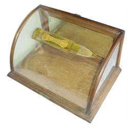 Small curved glass display case advertising "Remington Arms & Shells," rare, made in Chicago.