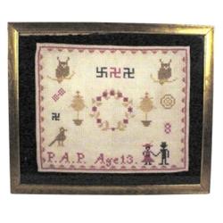Framed old sampler, signed P.A. P.  Age 13, embroidered swastikas, owls, tree & people, 20" x 17".