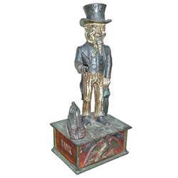 Uncle Sam mechanical bank, Shepard Hardware, Buffalo, NY, C.1886. 11 H, original paint & key.