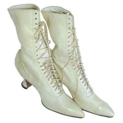 Pair of vintage ladies white high top laced shoes w/hourglass heels.