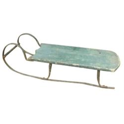 Early toy sled, green w/iron frame.