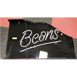 NEON SIGN "BEANS" ILLUMINATES IN GREEN
