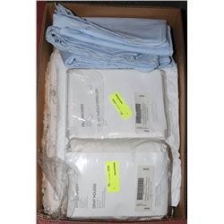 FLAT OF ASSORTED NEW TABLE CLOTHS,& BED