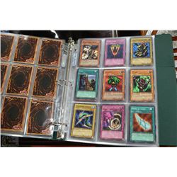 ALBUM OF 180 VINTAGE YU-GI-OH TRADING CARDS