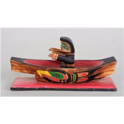Northwest Coast Carved Canoe with Painted Eagle Design and an Articulated Native Figure 10 1/2" W. 5