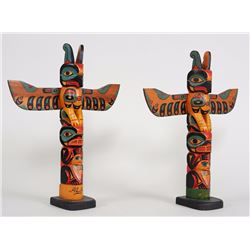 Pair of Tlingit Totems Carved with Thunderbird and Bear Holding Human Attributed To Joe Tassel 16 1/