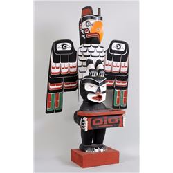 Kwagiulth Totem with Thunderbird and Dsonoqua Holding a Box Carved by Oscar Matilpi  50" H. 28 1/2" 
