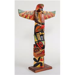 Clayoquot Totem Carved with Eagle Holding Copper, Whale and Wolf by W. Jackson 21 3/4" H. 15" W.  Go