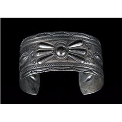 Navajo Silver Bracelet with Stamped Design ca. 1940  40 GMS 5 1/2" L. 1 1/4" W. 1 1/8" W. Gap  Good 