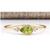 Image 1 : .58 CTW Natural Peridot And Diamond Ring In 14k Yellow Gold
