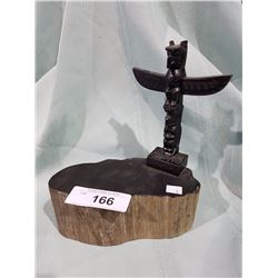 COMPOSITE TOTEM POLE ON A PIECE OF ARGELITE
