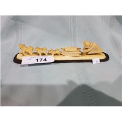 CARVED MARINE IVORY ESKIMO W/DOGSLED TEAM