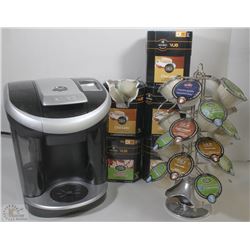 BOX OF KEURIG COFFEE MACHINE, PODS AND POD STAND