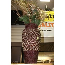 A LARGE VASE WITH CHRISTMAS DECORATIONS