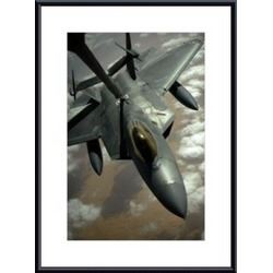 A U.S. Air Force F-22 Raptor is refueled by a KC-10A Extender aircraft over southwest Asia. framed b