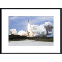 Space Shuttle Atlantis lifts off from its launch pad toward Earth orbit. framed black metal white ma