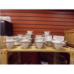 TEA CUPS AND SAUCERS