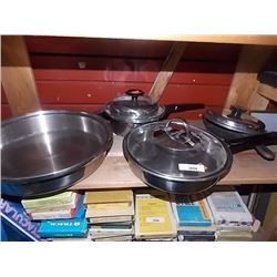 SHELF OF PANS, LIDS AND POTS