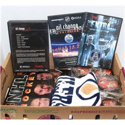 BOX OF HOCKEY DVDS, PUCKS, BOOK & CRYING TOWEL