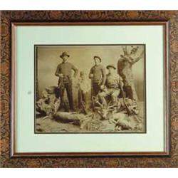 IMPERIAL SIZE PHOTOGRAPH OF SUCCESSFUL GROUP OF HUNTERS.  