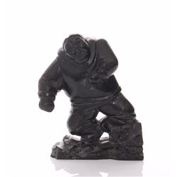 Vintage Inuit stone carving depicting an Eskim