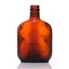 Image 1 : Mid Century brown glass whiskey bottle. The "F