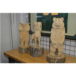 Three pieces of chain saw art carvings including an owl ,sheep and 24  bear