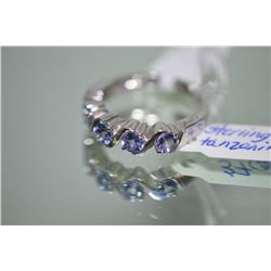 Two sterling silver and genuine tanzanite gemstone rings including multi-cluster dinner ring and fiv