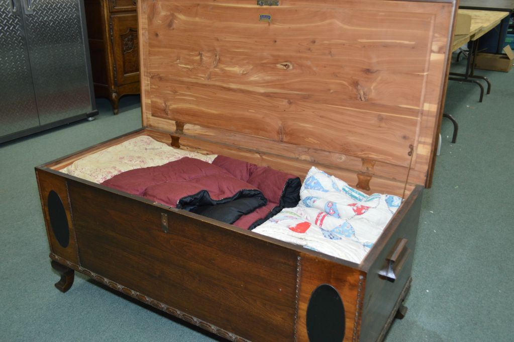 Vintage wooden Eatonia cedar lined blanket chest with four handmade quilts