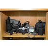 Image 1 : Two shelf lots of vintage cameras and camera equipment including Pentax, Gold star VHS movie camera,