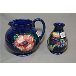 Two pieces of Moorcroft pottery including Anemone just and a 4 1/2  Iris vase