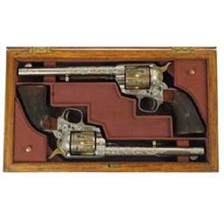 SPECTACULAR PAIR OF NIMSCHKE ENGRAVED GOLD & NICKEL SINGLE ACTION ARMY REVOLVERS.  