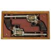 Image 1 : SPECTACULAR PAIR OF NIMSCHKE ENGRAVED GOLD & NICKEL SINGLE ACTION ARMY REVOLVERS.  