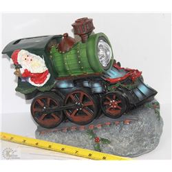 SOLAR SANTA IN A GREEN TRAIN
