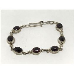 #17-STERLING SILVER GARNET BRACELET