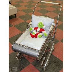 VINTAGE STROLLER WITH PLUSH GRINCH