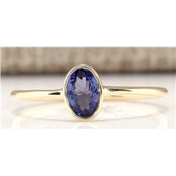 .60 CTW Natural Tanzanite And Diamond Ring In 14k Yellow Gold