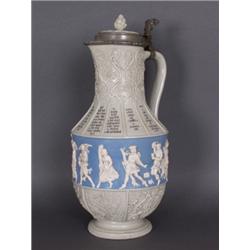 Porzellan : Schenkkanne. Monatskanne. Grau glasiertes Porzellan. Auf der Wandung in blauem Fond umla