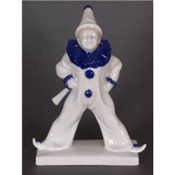 Porzellan : Porzellanfigur. Clown. Auf rechteckigem Sockel stehende Figur. Dezente Bemalung in Blau.