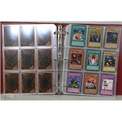ALBUM OF 180 VINTAGE YU-GI-OH TRADING CARDS