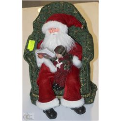 SANTA AND CHILD SITTING IN CHAIR
