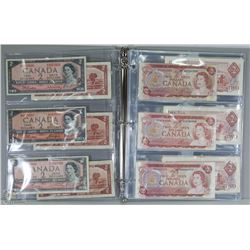 BINDER WITH 42 ASSORTED CANADIAN $2 DOLLARS AND $1