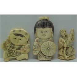 Three carved netsukes, 2" high man with pipe and