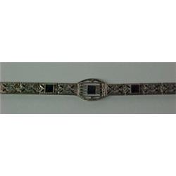 10K white gold filigree bracelet measuring 7"