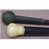 Image 1 : Two walking sticks, the first with wooden shaft