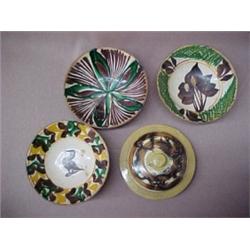 Three redware bowls and a mocha ware lid, bowls