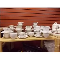 TEA CUPS AND SAUCERS