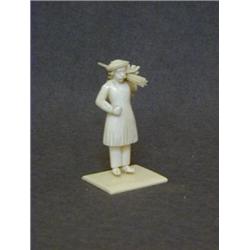 AN INDIAN BONE FIGURE, late 19th Century, figure carrying lances, height 9cm  30-40...