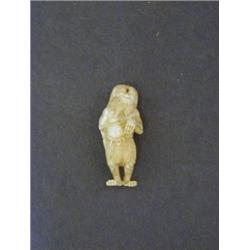 AN IVORY NETSUKE, one eyed monster with snake, signed on leg, height 7cm  50-80...