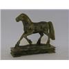 Image 1 : A GREEN SOAPSTONE FIGURE, 20th Century, trotting horse, rectangular plinth, height 16cm  20-30...